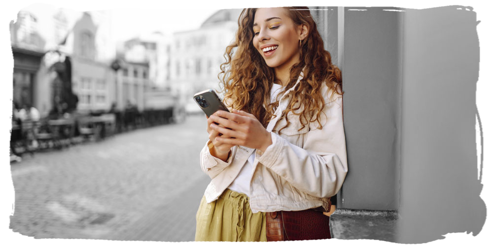 Woman smiling at smart phone